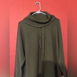 Dark green turtle neck active sweater.